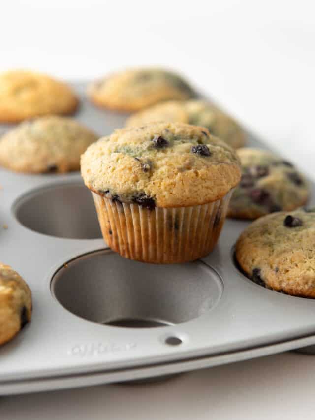 sour cream blueberry muffins on pan