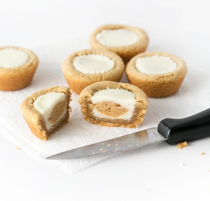 Cut white chocolate peanut butter cookie in half for watermelon cookie cups