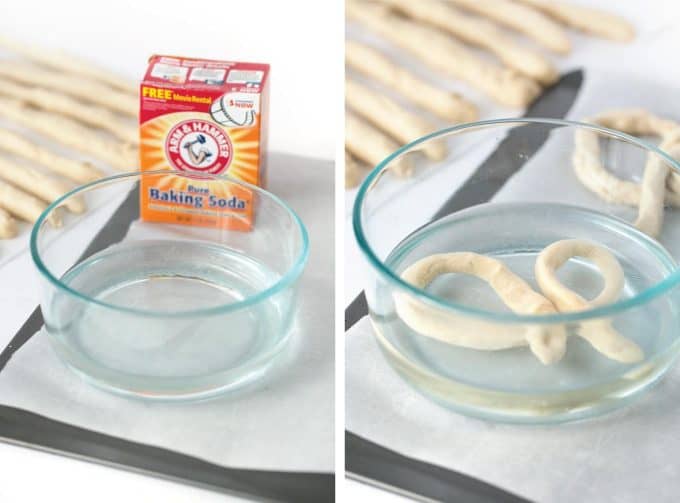 Dipping pretzels in baking soda and water to make homemade soft pretzels