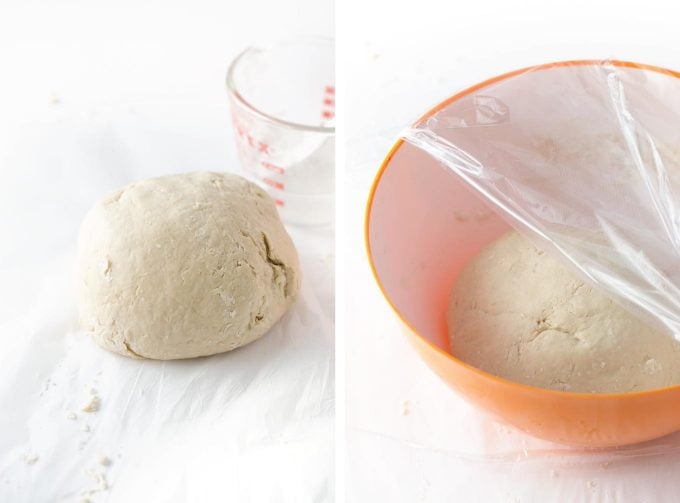 Ball of dough in bowl with plastic wrap to make homemade soft pretzels