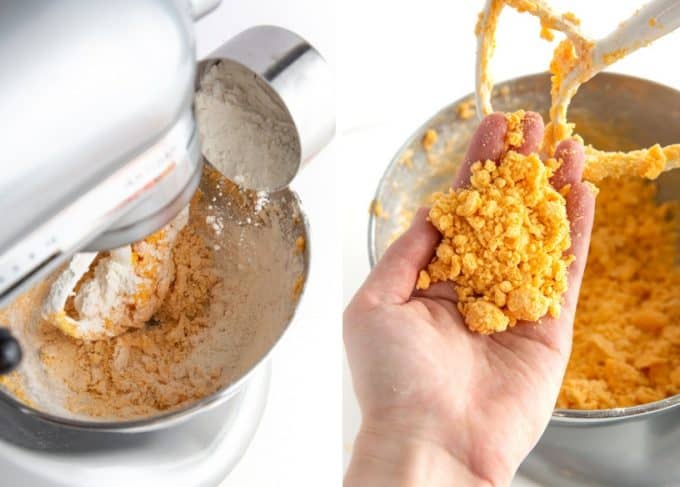 Adding flour to bowl, showing crumbly texture of homemade cheese cracker dough