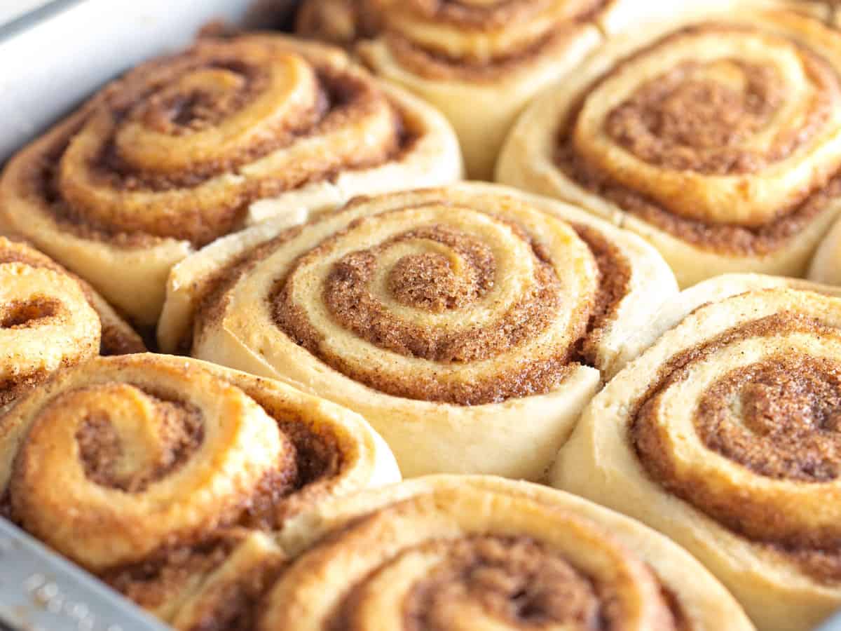 Pan of baked golden 1 hour cinnamon rolls