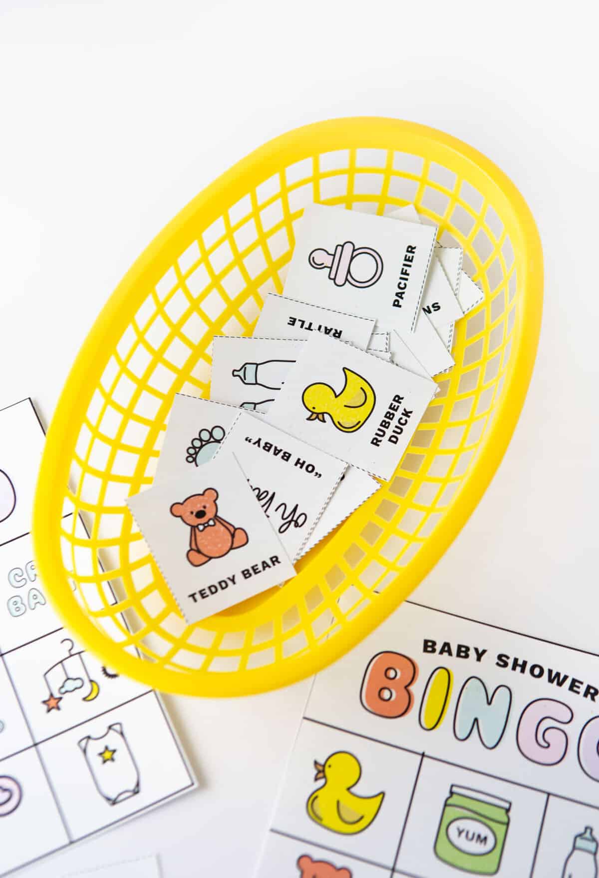 Basket of baby shower bingo calling cards
