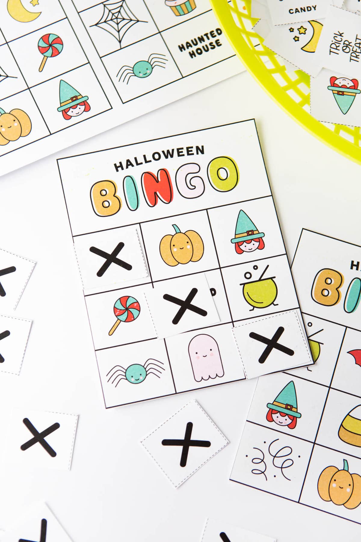 Colorful free printable Halloween bingo cards with icons and pictures: pumpkin, witch, lollipop, cauldron, spider, ghost