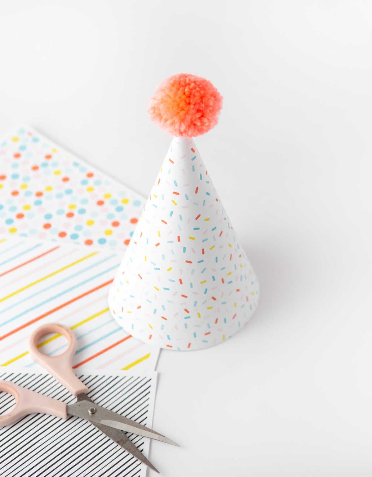 Sprinkle pattern party hat made with printable scrapbook paper