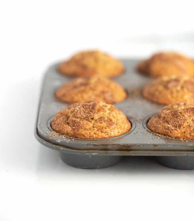 Metal muffin tin of banana muffins