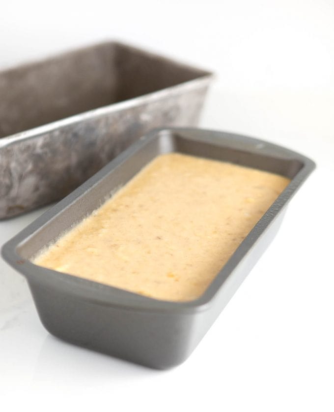 Metal loaf pan filled ⅔ full with banana bread batter