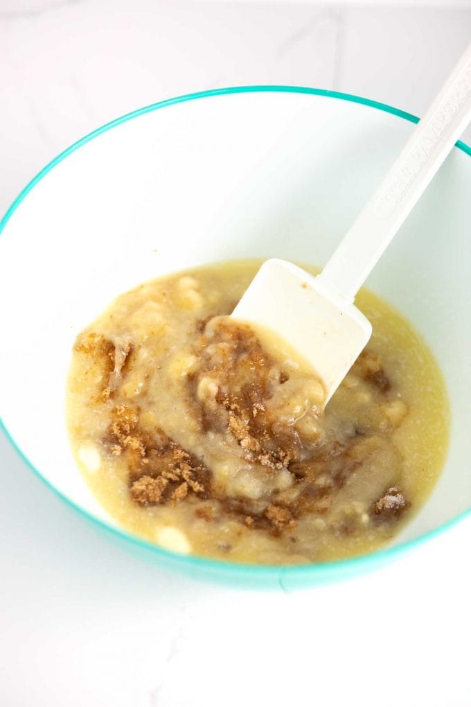 Stirring banana bread batter with spatula