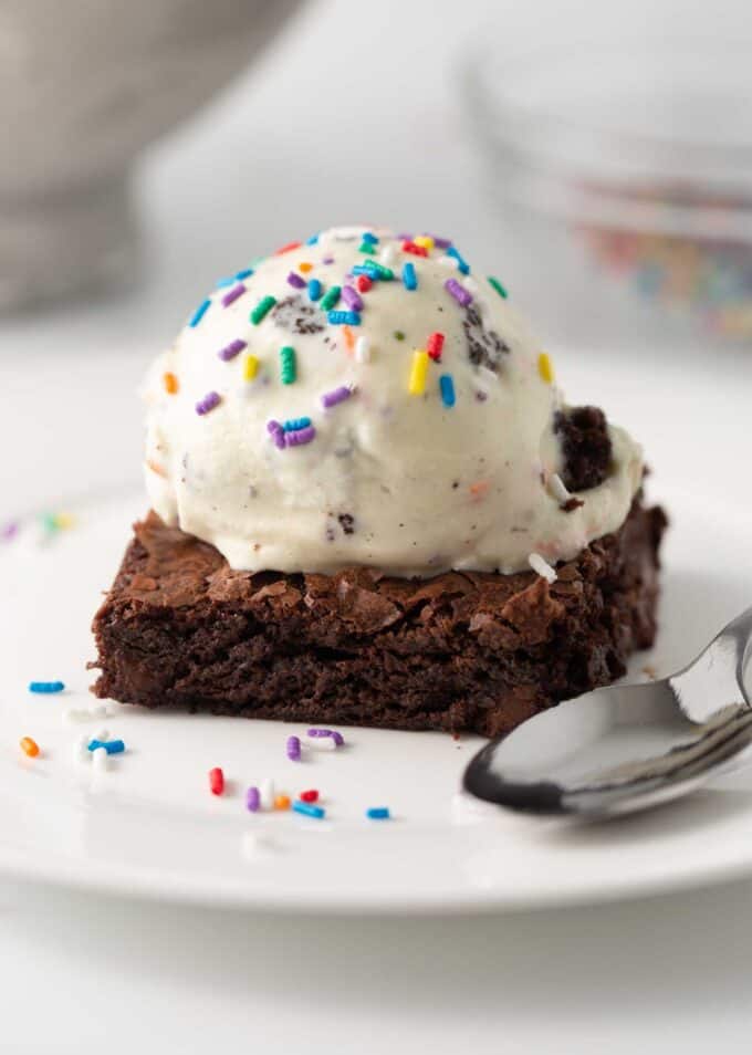 scoop of cake batter ice cream on brownie
