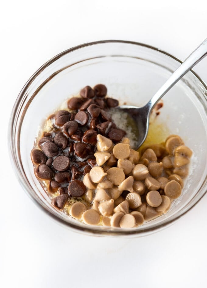 Bowl of melted butter mixed with chocolate chips and caramel chips 