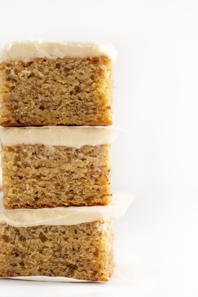 Stack of moist banana bars with cream cheese frosting