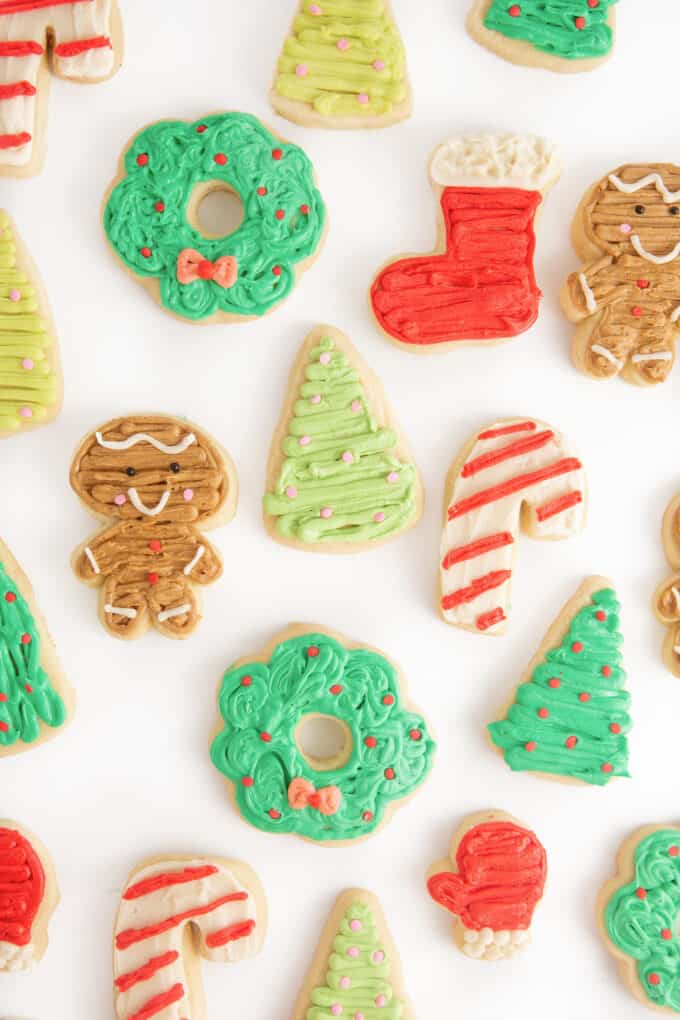 Assortment of decorated Christmas sugar cookies; a wreath, stocking, gingerbread man, christmas tree