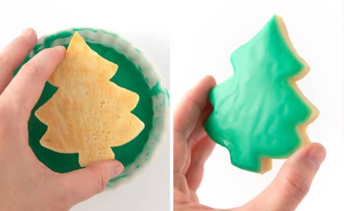 hand dipping sugar cookie in green icing glaze