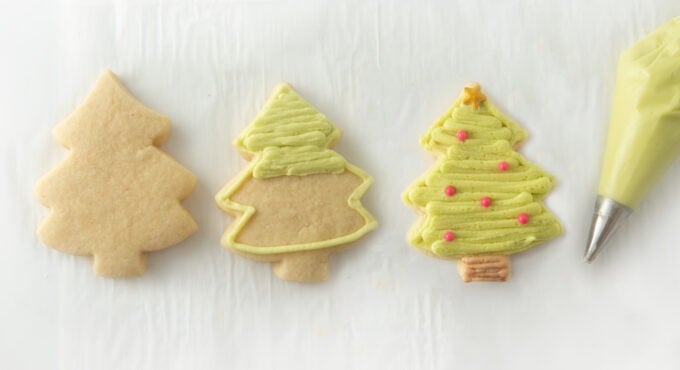 step by step photos on how to decorate striped decorated christmas tree cookies