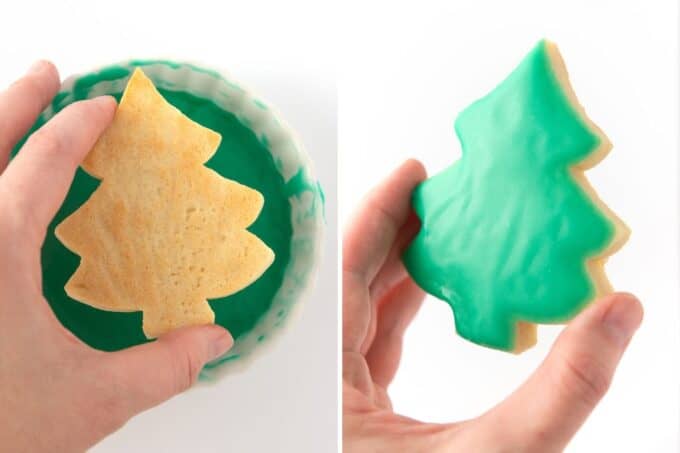 hand dipping christmas tree cookie in green sugar cookie glaze