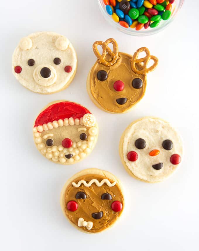 5 easy christmas cookie ideas for kids including reindeer, santa, snowman, gingerbread man, and polar bear