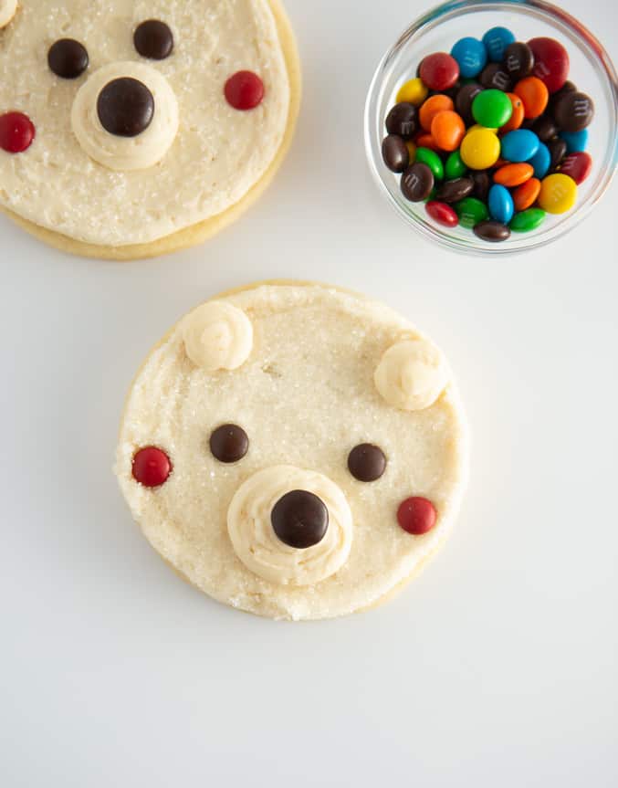 white polar bear cookies with M&M face