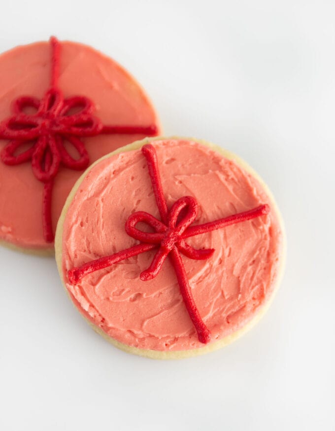 pink present sugar cookie with red bow