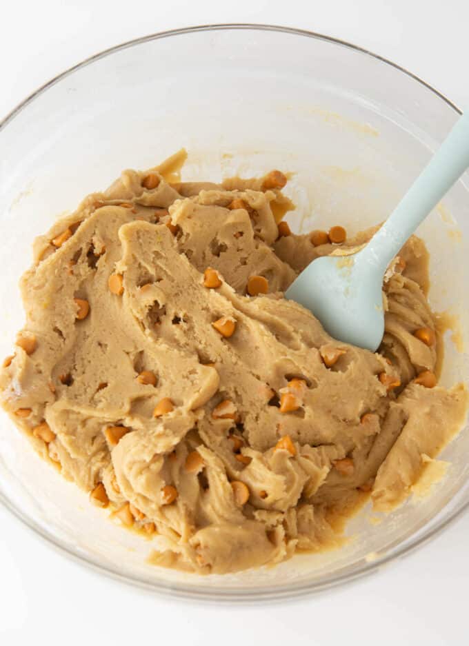 glass bowl of butterscotch cookie dough with butterscotch chips