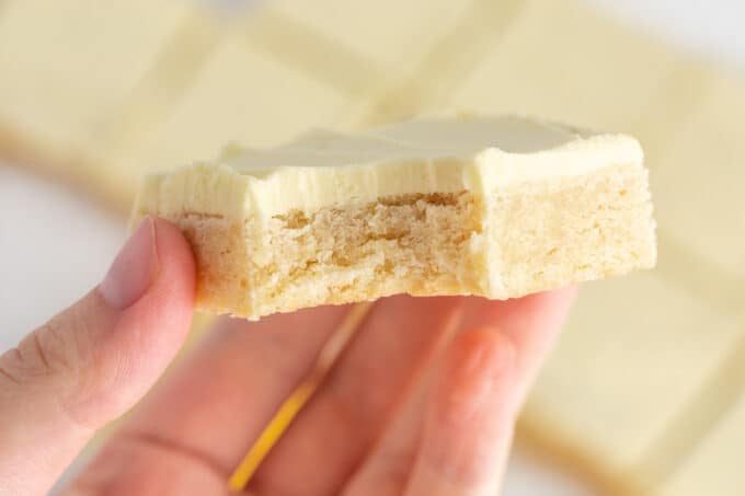 stack of lemon sugar cookie bars with lemon buttercream