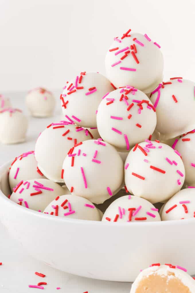 bowl of sugar cookie Valentine truffles with red and pink sprinkles