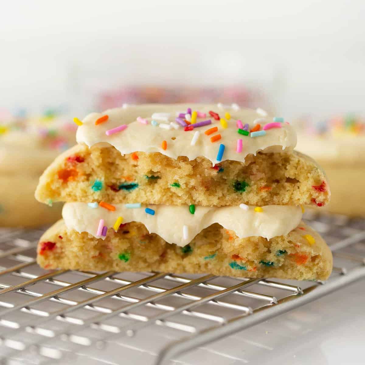 stack of birthday cake cookies cut in half to show texture