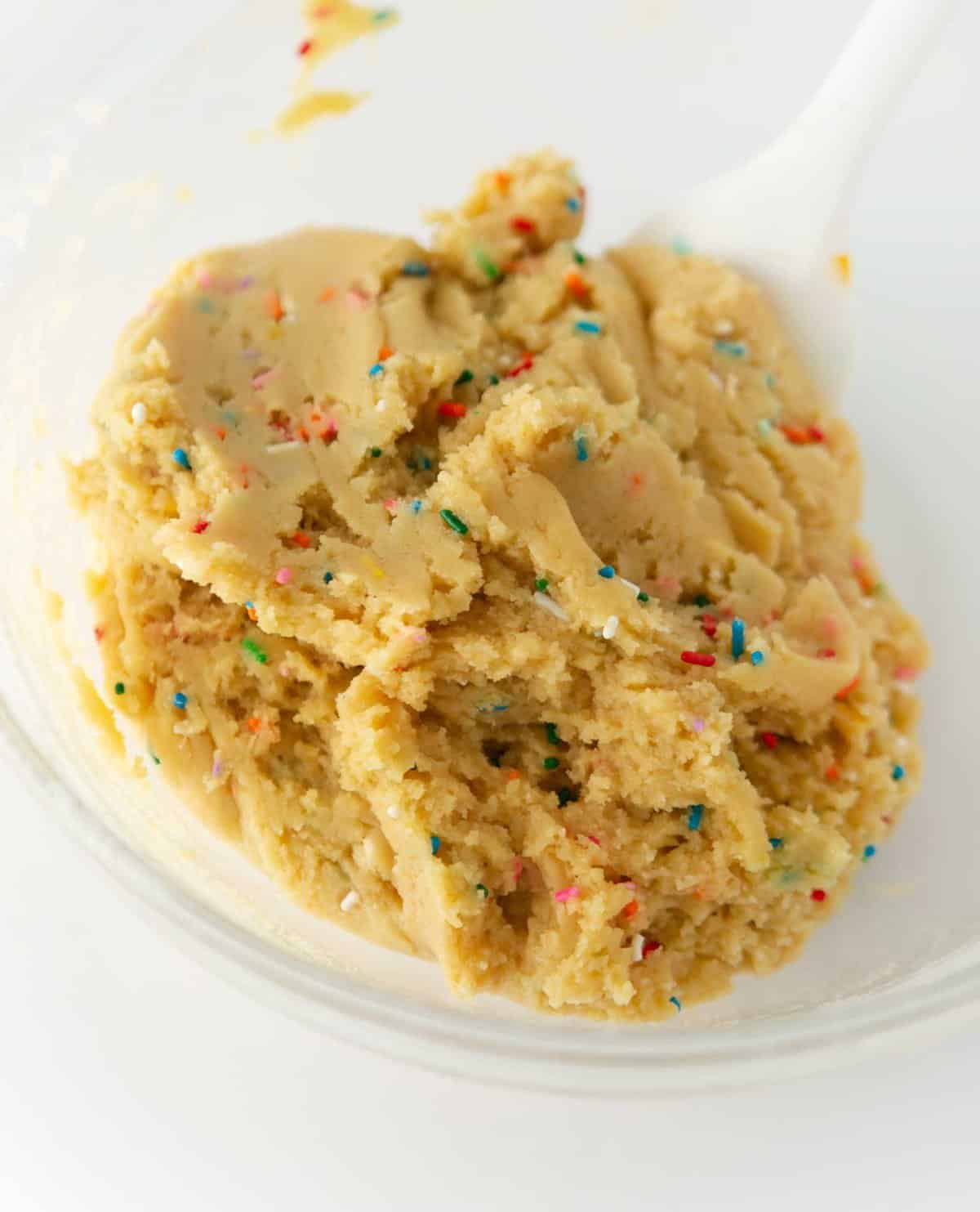 bowl of funfetti birthday cake cookie dough with sprinkles