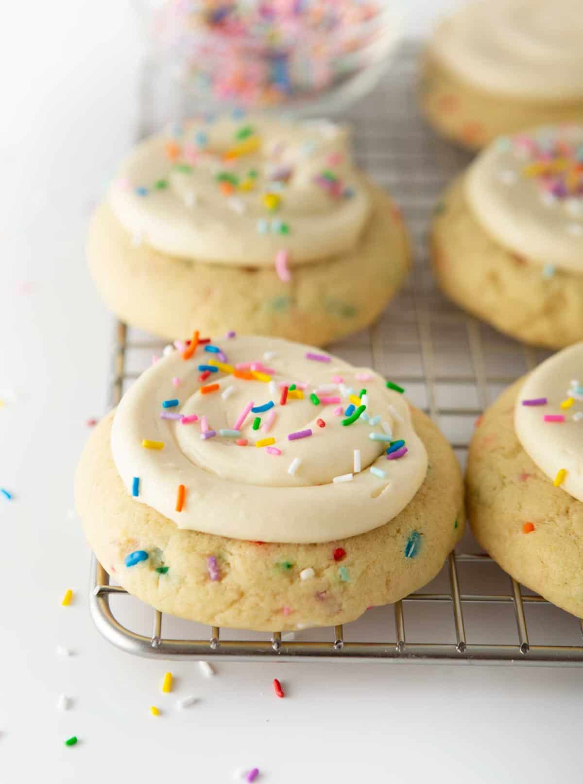 birthday cake cookies on metal cooking rack