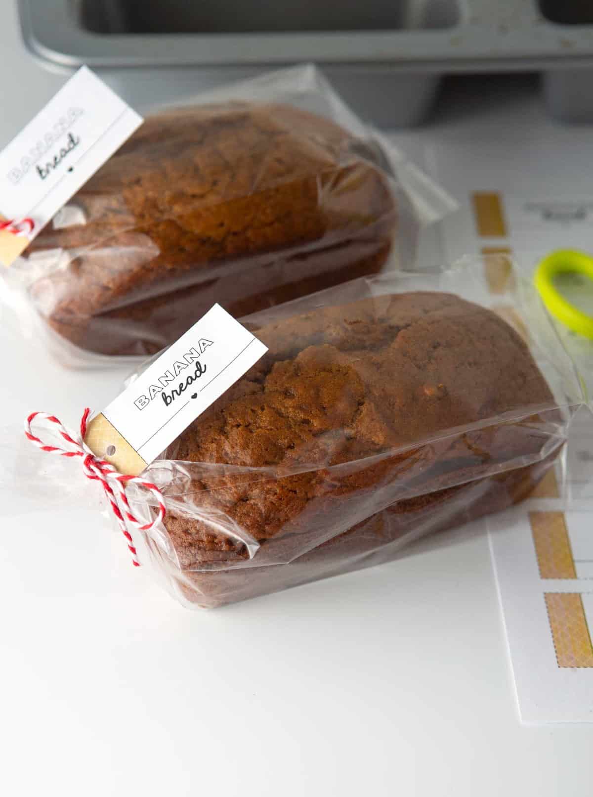 mini loaf of banana bread in plastic bag with gift tag