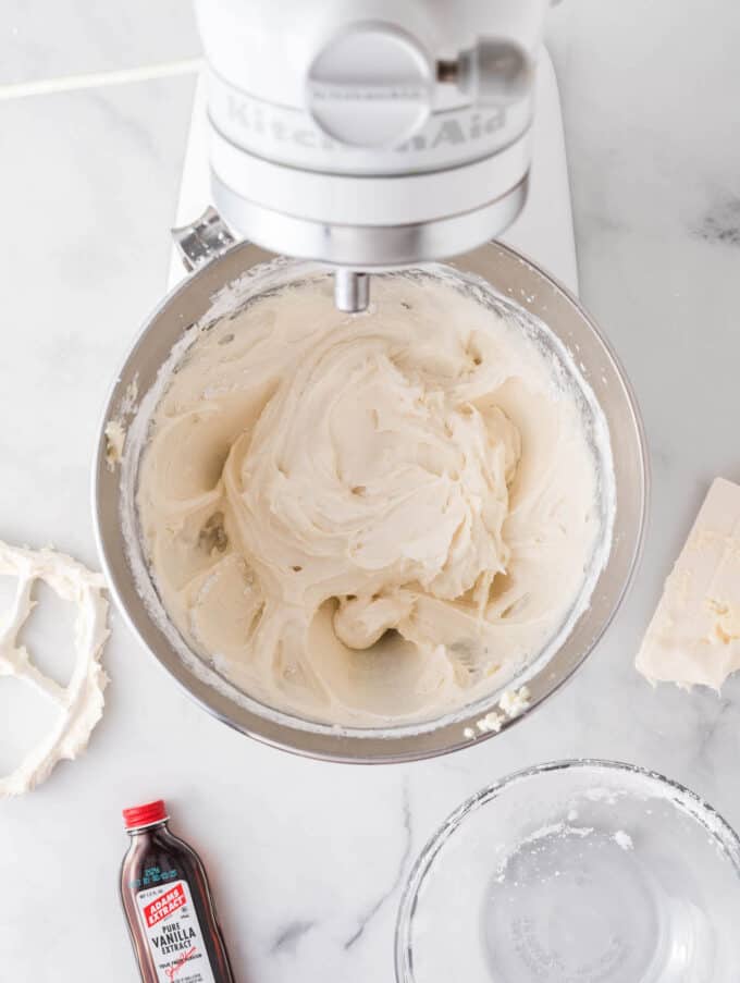 cream cheese frosting for berry pizza in white kitchenaid bowl