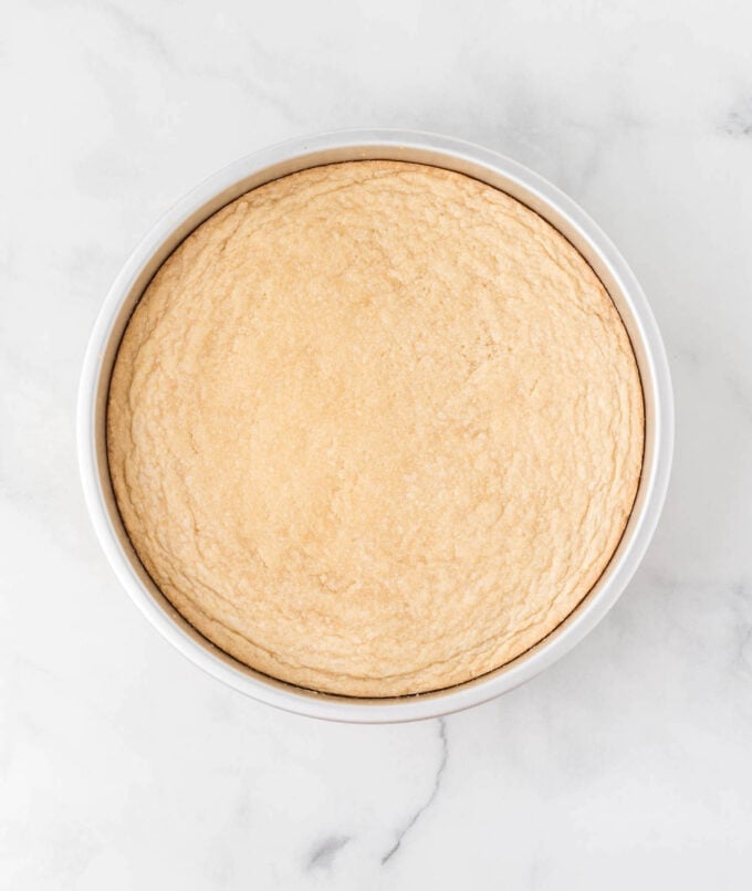 baked sugar cookie pizza in metal round pan