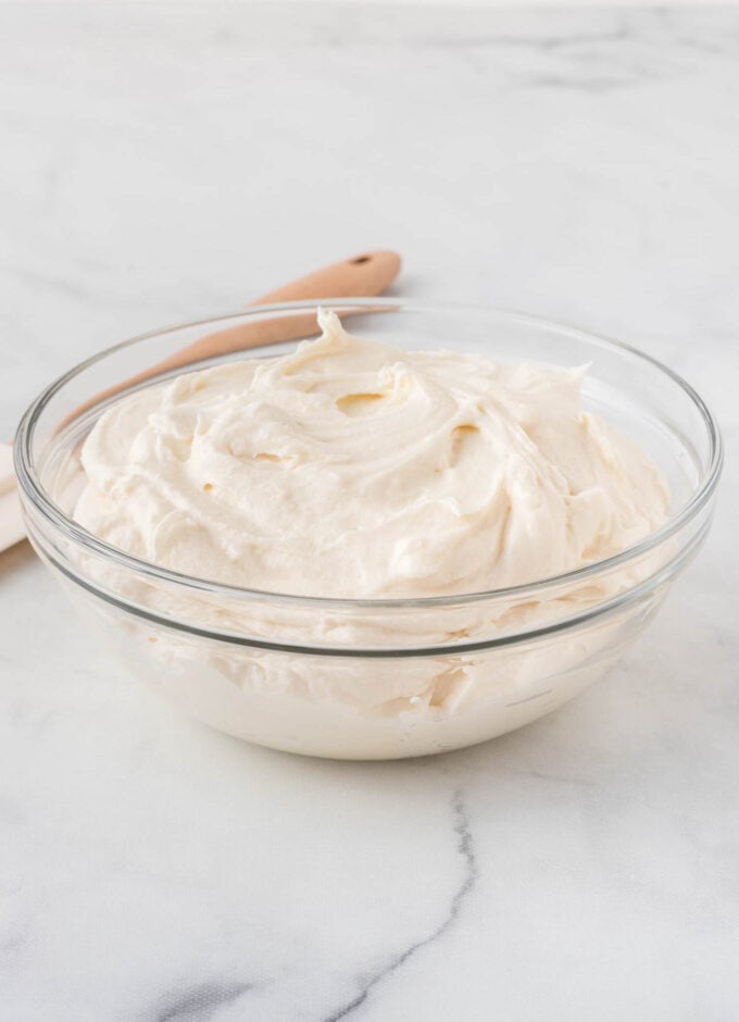 cream cheese frosting for berry pizza in glass bowl