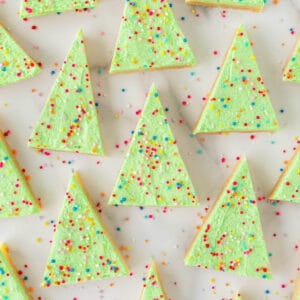 christmas tree sugar cookie bars with nonpareil sprinkles baked in 9x13 pan