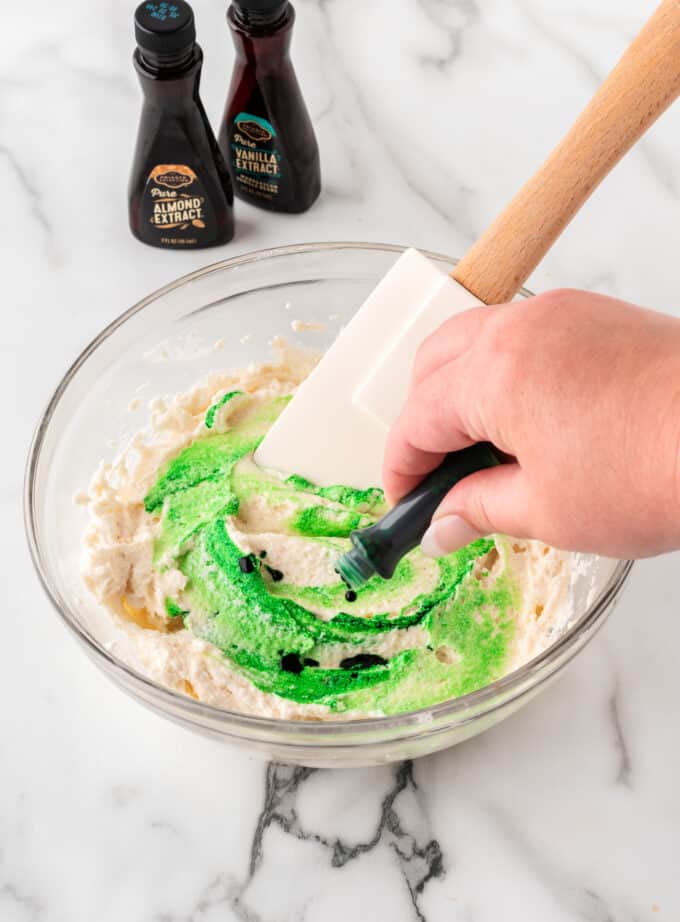 dyeing white frosting green with bottle of food coloring