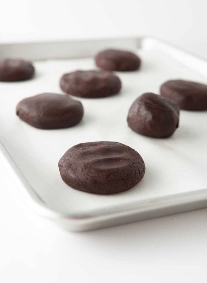 flattened cookie dough ball on pan