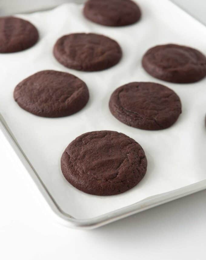 baked, unfrosted cosmic brownie cookies on pan