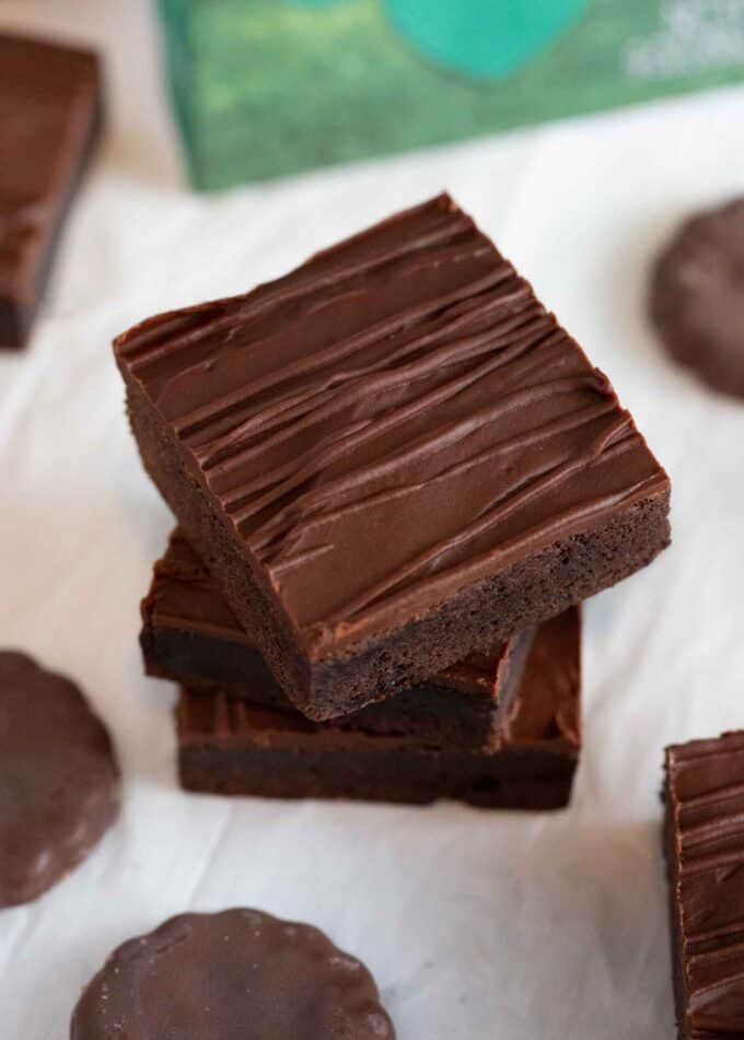 stack of chocolate thin mint square bars with chocolate drizzle