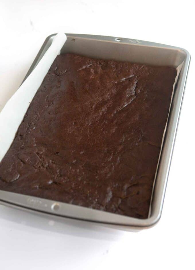 baked chocolate cookie dough pressed into 9x13 metal pan