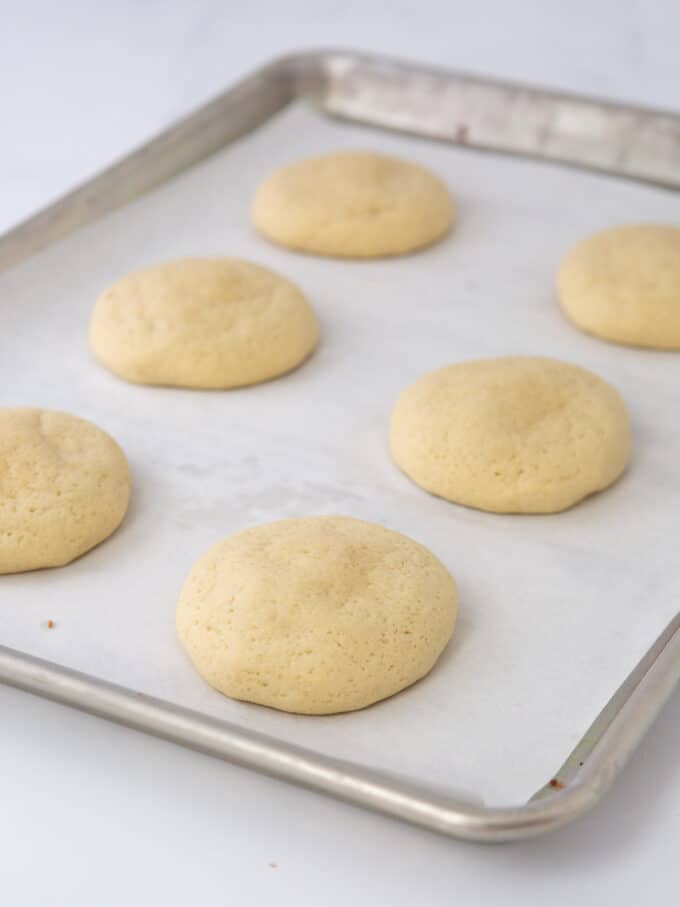 baked unfrosted coconut sugar cookies on baking tray