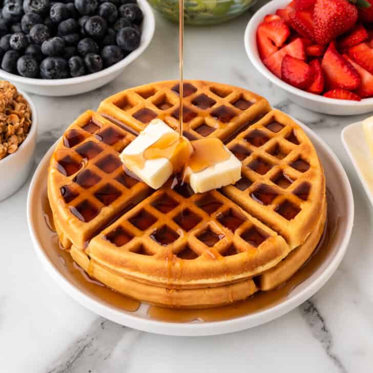 crispy belgian waffles with syrup and butter