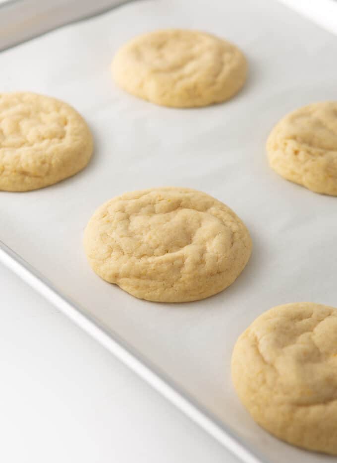 baked orange sugar cookies on cookie sheet