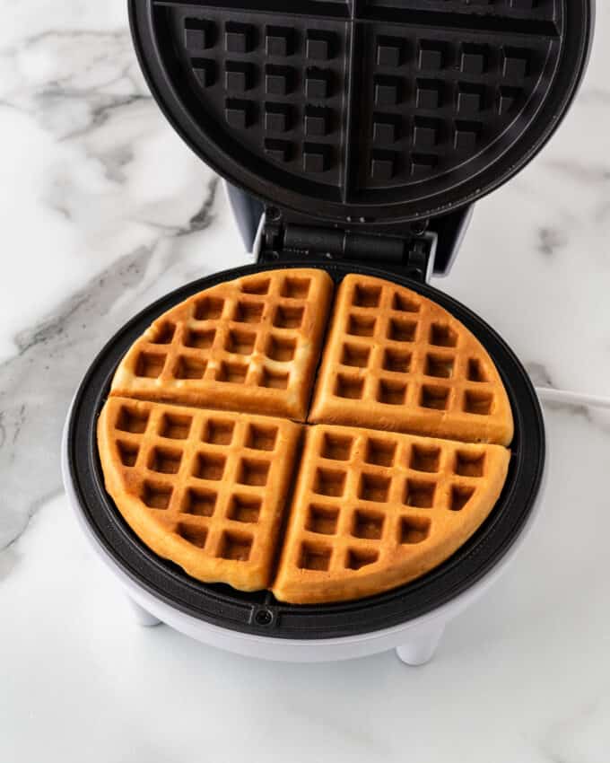 golden brown baked crispy waffle in round waffle iron