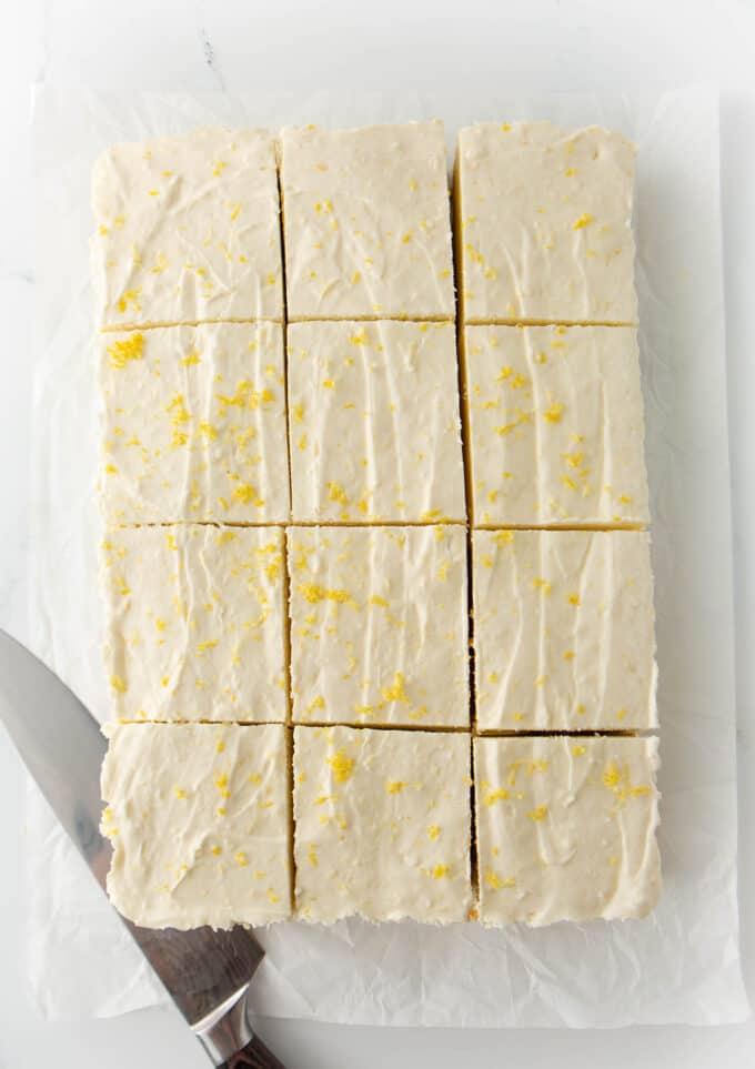 9x13 pan of no bake lemon cheesecake bars cut into 13 squares