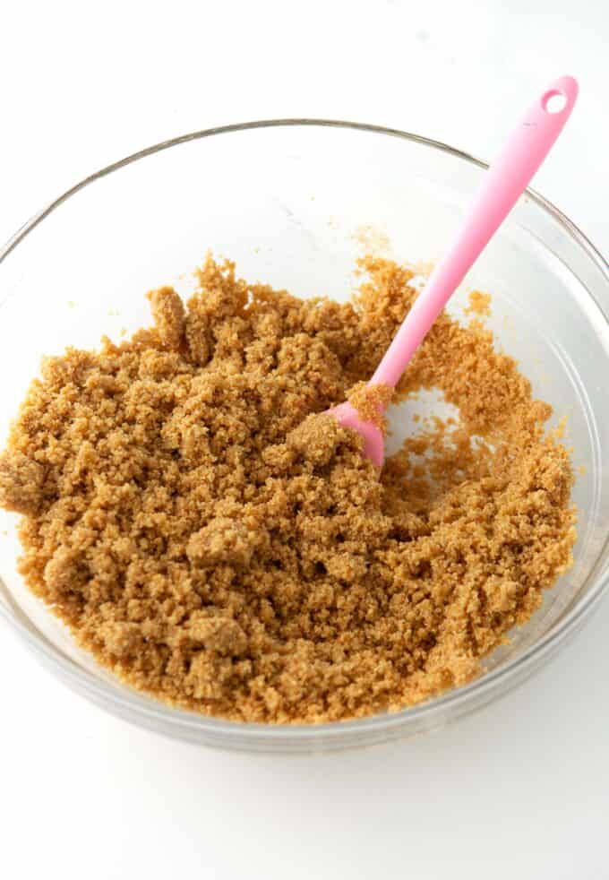 bowl of graham cracker crumbs mixed with melted butter
