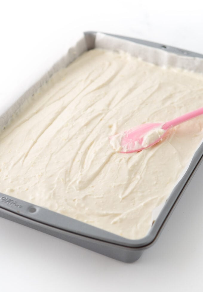 no bake lemon cheesecake filling spread in 9x13 pan