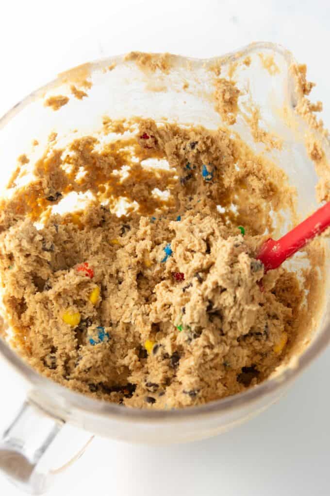 monster cookie bar dough in glass bowl