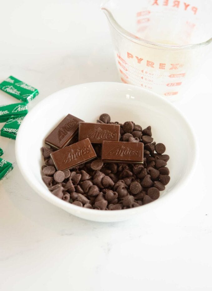 white bowl of chocolate chips and andes mint candies