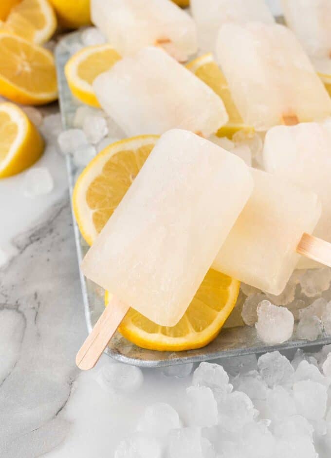 lemon popsicles on tray of ice