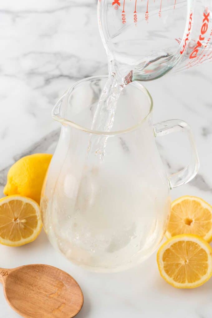 pouring cold water into pitcher