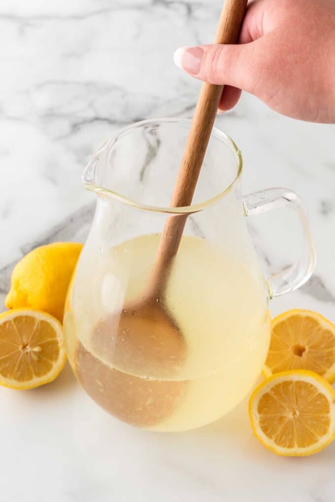 mixing pitcher of homemade lemonade